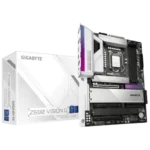 Angle view of a Gigabyte motherboard installed in a PC, with Gigabyte-branded product boxes in the background