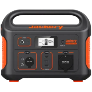 Close-up of a Jackery portable power station front panel with outlets and a digital display under a black casing and orange accents.