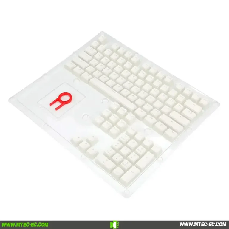 White keyboard sealed in clear plastic packaging, viewed at an angle.