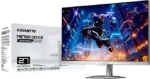 Gigabyte M27Q gaming monitor packaging beside a silver monitor displaying an action game in a neon cityscape.