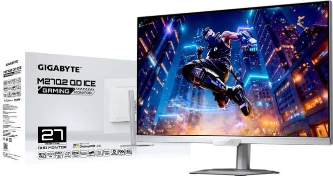 Gigabyte M27Q gaming monitor packaging beside a silver monitor displaying an action game in a neon cityscape.