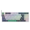 Compact mechanical keyboard with rainbow RGB backlighting on a dark background.